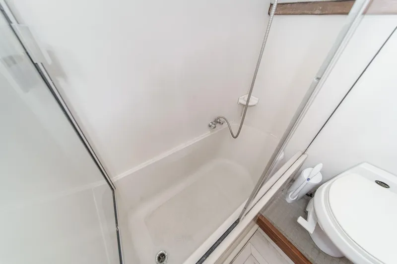 Slide: The Image of Bathroom interior of 1991 Californian 55 Cockpit Motor Yacht with shower and toilet. - 43