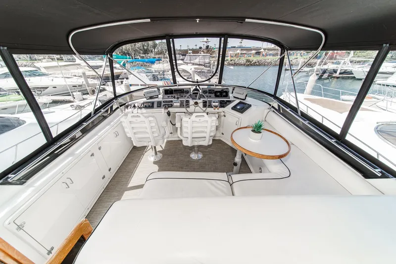 Slide: The Image of Luxurious cockpit of a 1991 Californian 55 Motor Yacht with modern controls and seating. - 47
