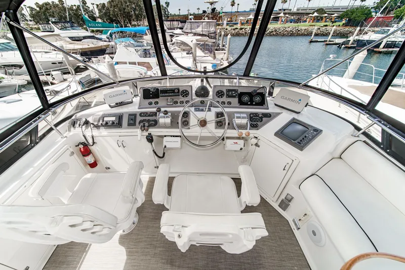 Slide: The Image of Cockpit of 1991 Californian 55 Cockpit Motor Yacht with navigation equipment and seating. - 48