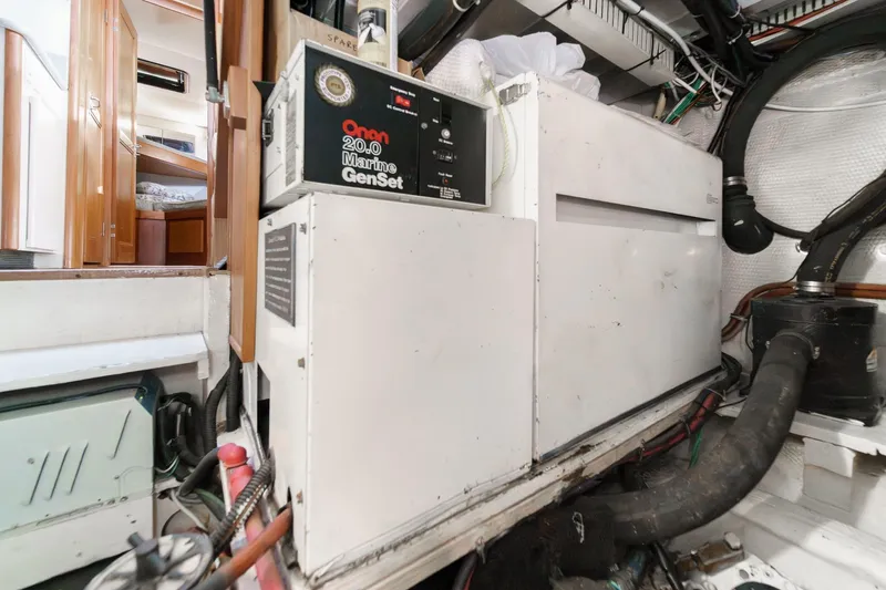 Slide: The Image of Engine room of 1991 Californian 55 Cockpit Motor Yacht with Onan Marine GenSet. - 56