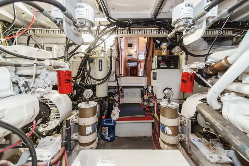 Slide: The Image of Engine room of 1991 Californian 55 Cockpit Motor Yacht, showcasing machinery and equipment. - 57