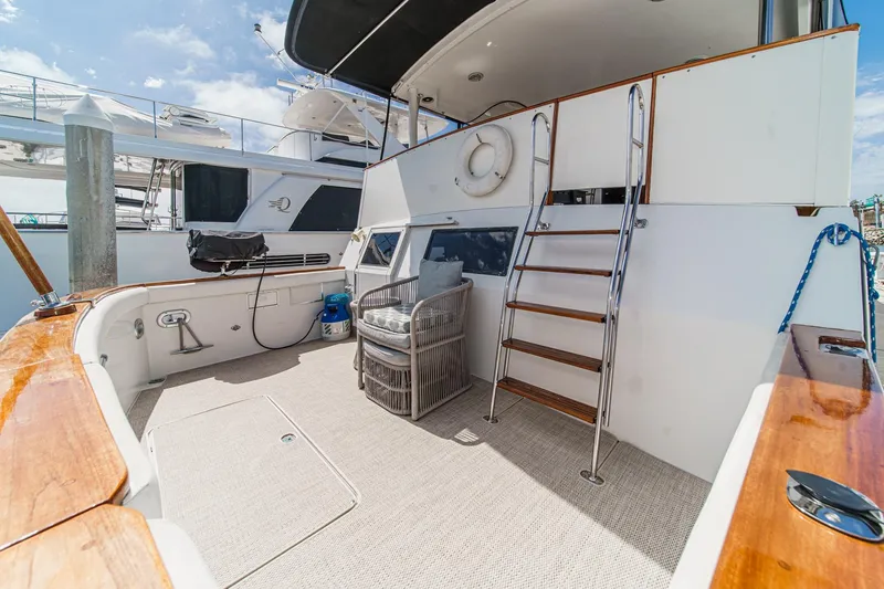 Slide: The Image of 1991 Californian 55 Cockpit Motor Yacht with spacious deck and elegant wooden accents. - 9