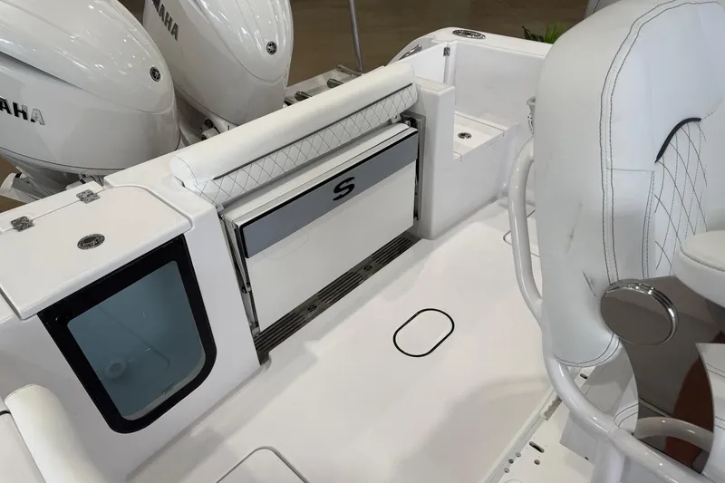 Slide: The Image of 2026 Sportsman Open 252 Center Console boat interior with Yamaha engines and seating. - 13