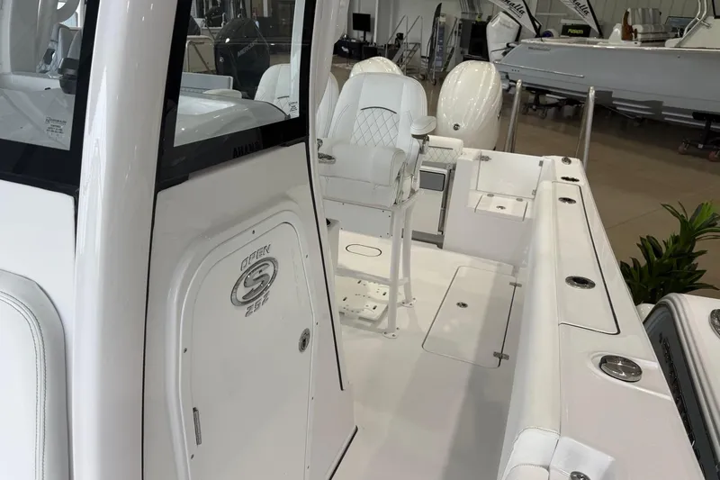 Slide: The Image of 2026 Sportsman Open 252 Center Console boat interior with seating and storage compartments. - 6