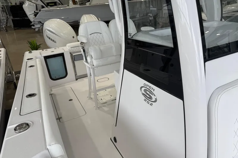 Slide: The Image of 2026 Sportsman Open 252 Center Console boat interior with seating and console details. - 7