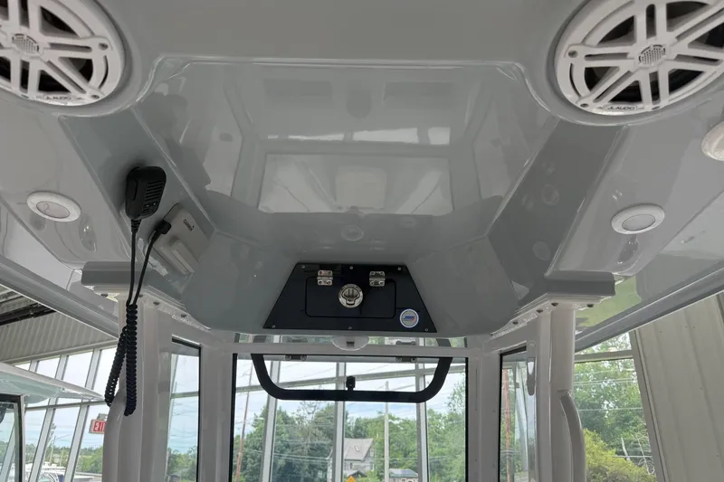 Slide: The Image of 2026 Sportsman Open 252 Center Console boat interior with speakers and communication equipment. - 9