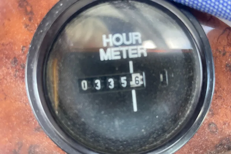Slide: The Image of Hour meter reading 335.6 on 2006 Bayliner 305 boat dashboard. - 12