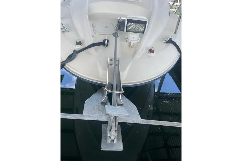 Slide: The Image of Bow view of 2006 Bayliner 305 boat with anchor and spotlight. - 36