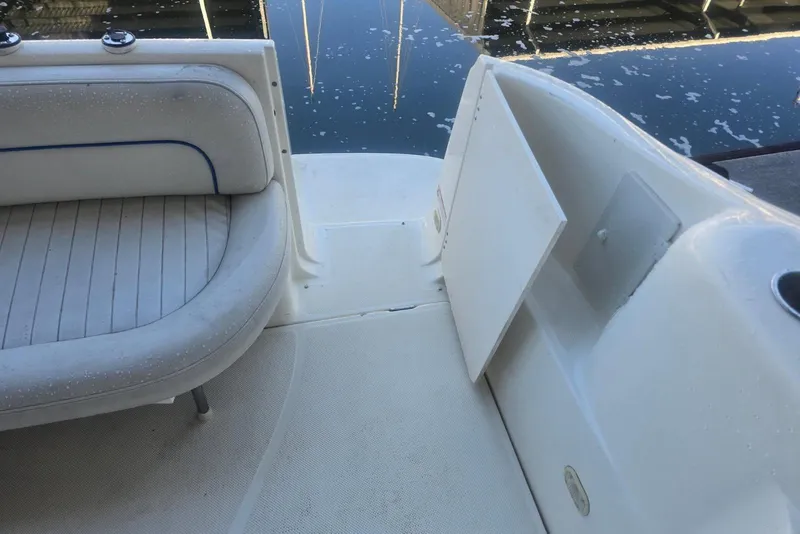 Slide: The Image of Interior view of a 2006 Bayliner 305 boat, featuring seating and deck details. - 7