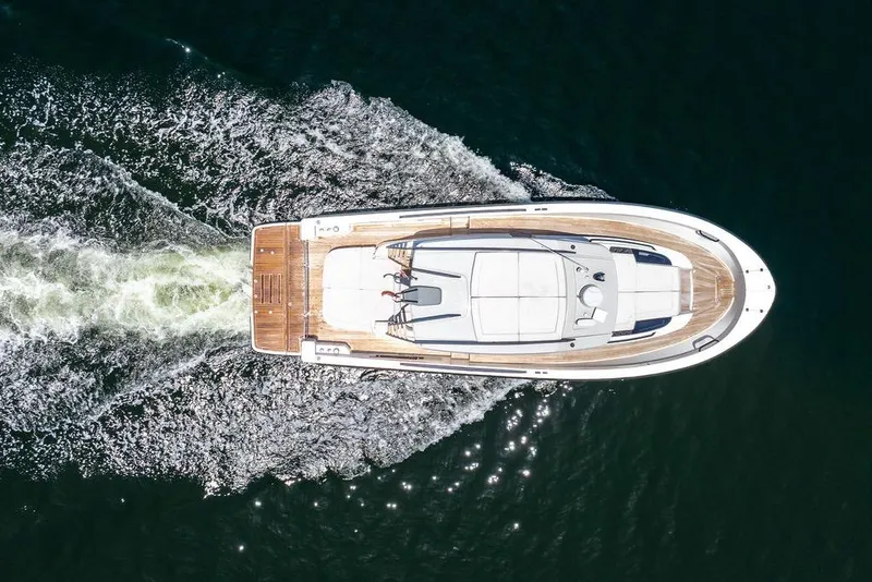 Slide: The Image of Aerial view of 2021 Bluegame BG 42 yacht cruising on water. - 24