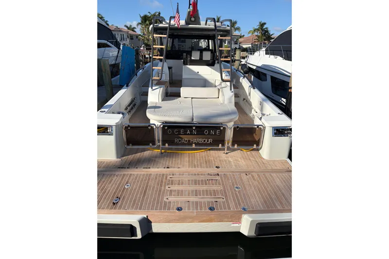 Slide: The Image of 2021 Bluegame BG 42 yacht docked, featuring spacious deck and modern design. - 3