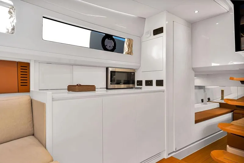 Slide: The Image of Modern interior of 2021 Bluegame BG 42 yacht with sleek kitchen and seating area. - 44