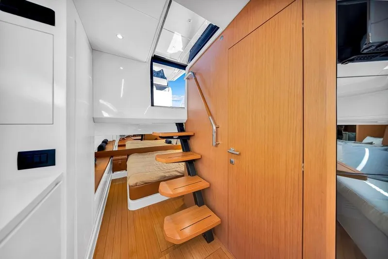 Slide: The Image of Interior of 2021 Bluegame BG 42 yacht with wooden stairs and cozy cabin. - 53