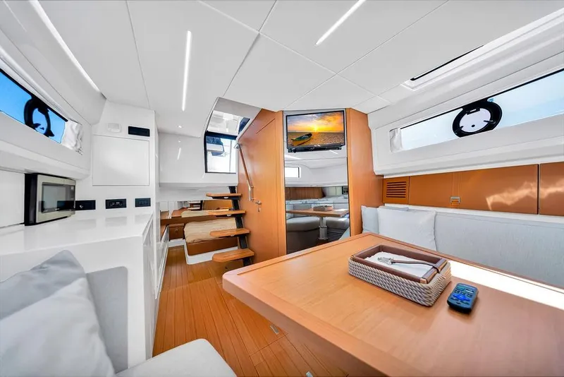 Slide: The Image of Luxurious interior of 2021 Bluegame BG 42 yacht with modern furnishings and natural light. - 54