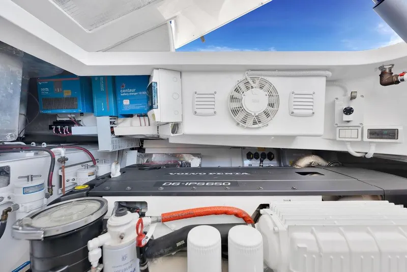 Slide: The Image of Engine room of 2021 Bluegame BG 42 yacht with Volvo Penta engine and Centaur battery charger. - 63