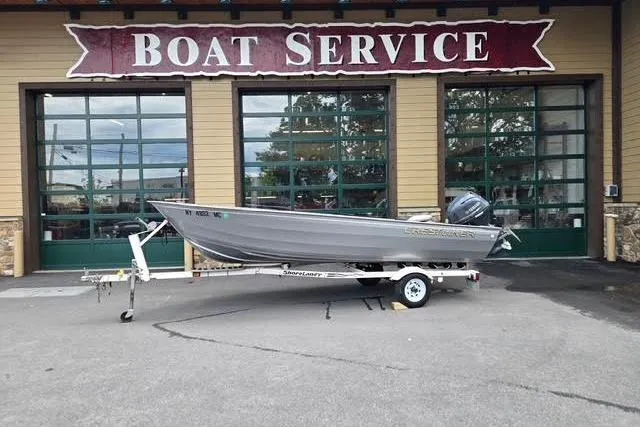 Slide: The Image of 2005 Crestliner Sportsman 16 boat on trailer outside service center. - 9