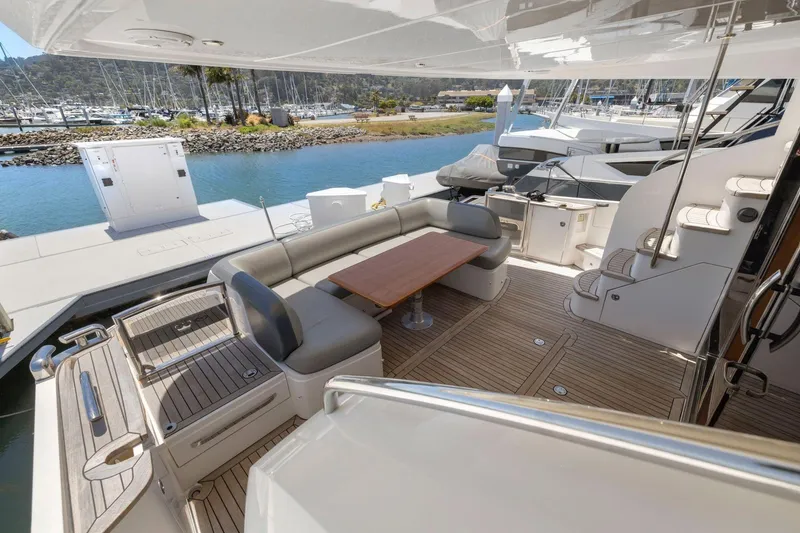 Slide: The Image of Luxurious 2015 Princess 60 Flybridge Motor Yacht with spacious deck and elegant seating area. - 10