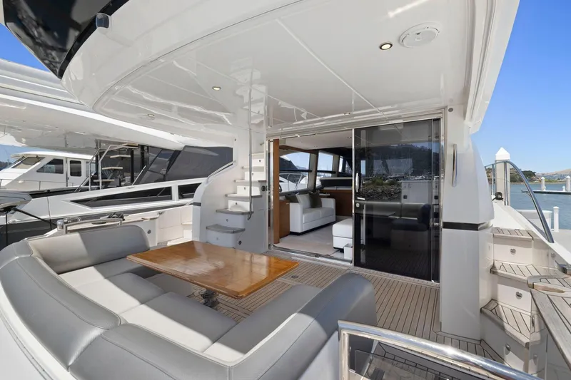 Slide: The Image of Luxurious 2015 Princess 60 Flybridge Motor Yacht with spacious seating and elegant interior. - 8