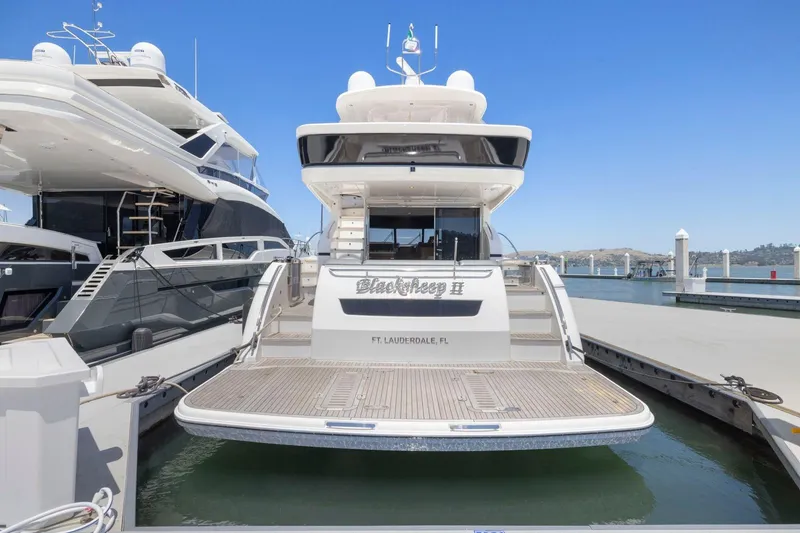 Slide: The Image of 2015 Princess 60 Flybridge Motor Yacht docked at marina, rear view. - 3
