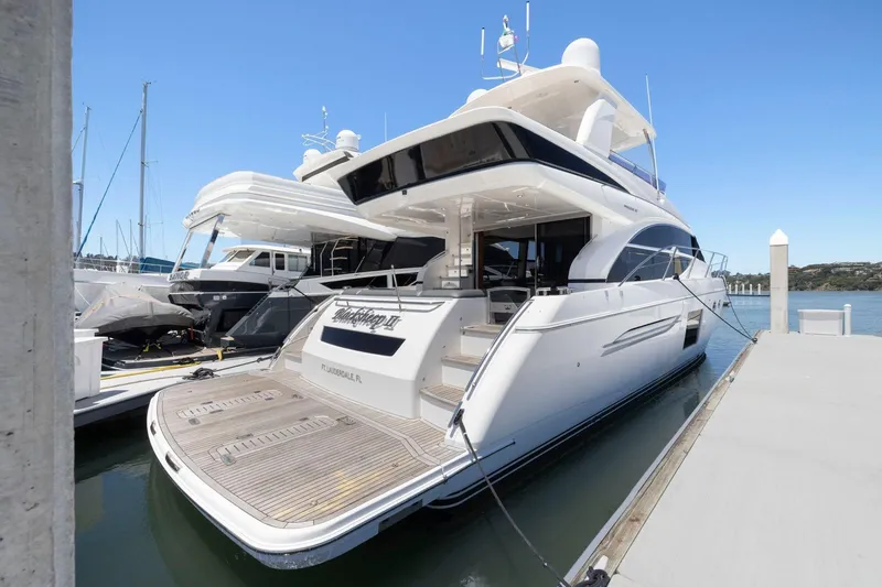 Slide: The Image of 2015 Princess 60 Flybridge Motor Yacht docked at marina, showcasing sleek design and luxury features. - 4