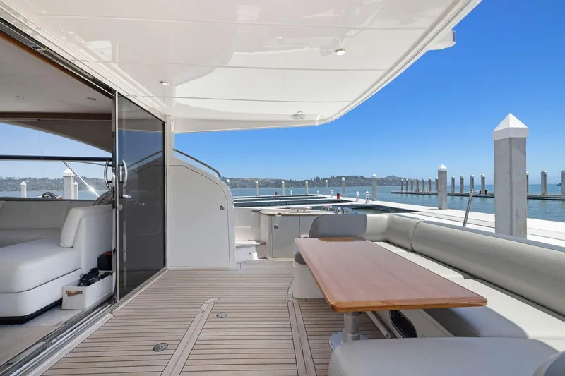 Slide: The Image of Luxurious 2015 Princess 60 Flybridge Motor Yacht with spacious deck and elegant seating area. - 12