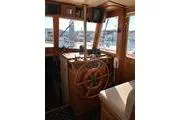 Slide: The Image of Interior helm of 1988 Grand Banks 46 Classic yacht with wooden steering wheel. - 10