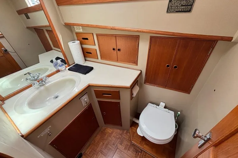 Slide: The Image of Bathroom interior of 1988 Grand Banks 46 Classic yacht with sink and toilet. - 15