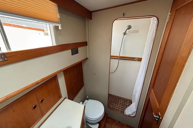 Slide: The Image of Bathroom interior of 1988 Grand Banks 46 Classic yacht with shower and toilet. - 16
