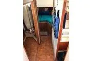 Slide: The Image of 1988 Grand Banks 46 Classic yacht interior with wood flooring and cozy cabin. - 6