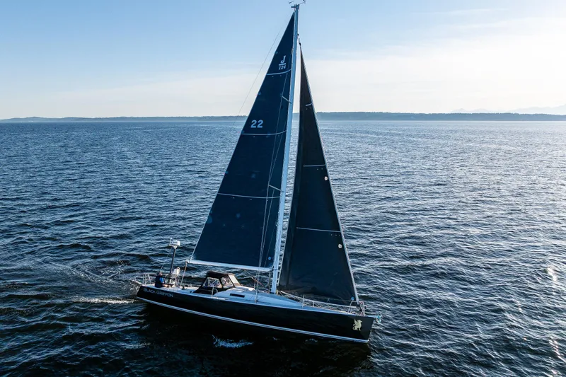 Slide: The Image of 2007 J Boats J/124 sailing on open water under clear skies. - 5