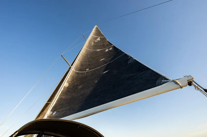 Slide: The Image of Sail of a 2007 J Boats J/124 yacht against a clear blue sky. - 8