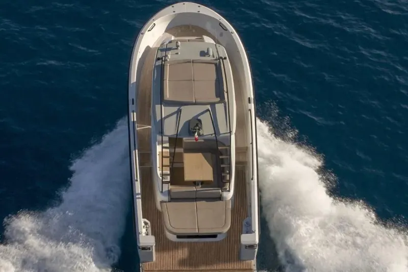 Slide: The Image of A modern motorboat cruising on open water, featuring sleek design and a spacious deck. - 4
