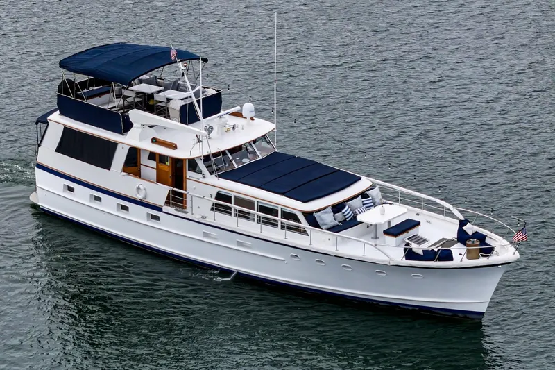 The Image of Vintage 1969 Burger Flush Deck yacht cruising on calm waters. - 0