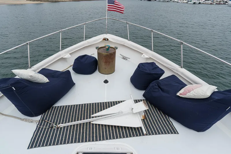 Slide: The Image of Bow of 1969 Burger Flush Deck yacht with bean bags and American flag. - 15