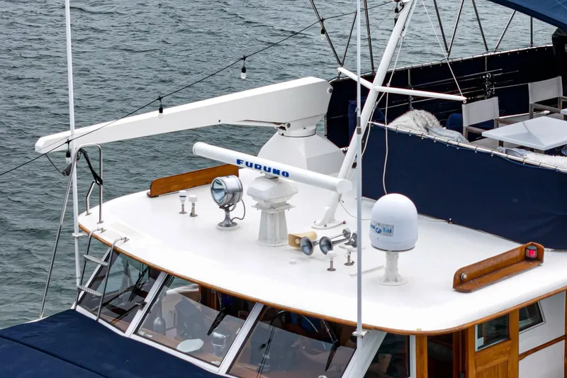 Slide: The Image of 1969 Burger Flush Deck yacht with navigation equipment and seating area on deck. - 23