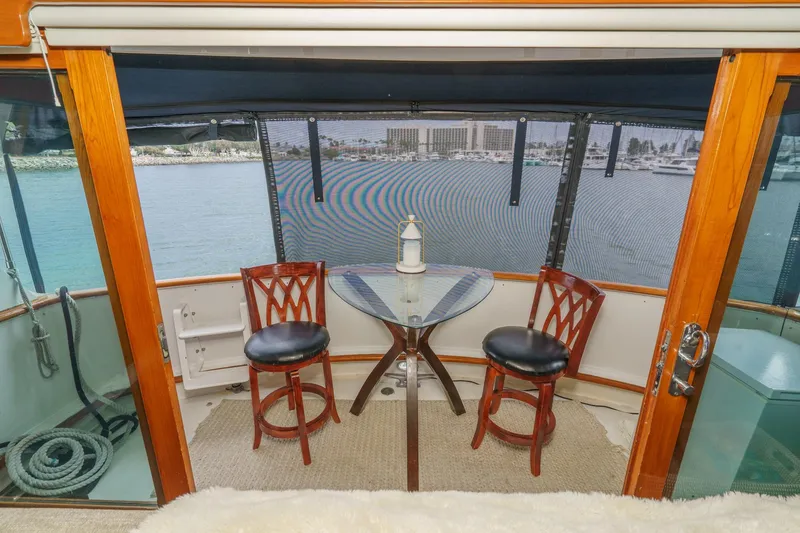 Slide: The Image of Interior view of 1969 Burger Flush Deck yacht with seating and ocean view. - 27