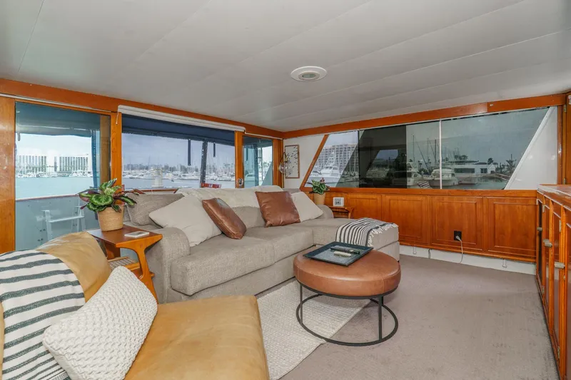 Slide: The Image of Luxurious 1969 Burger Flush Deck yacht interior with cozy seating and elegant wood paneling. - 29