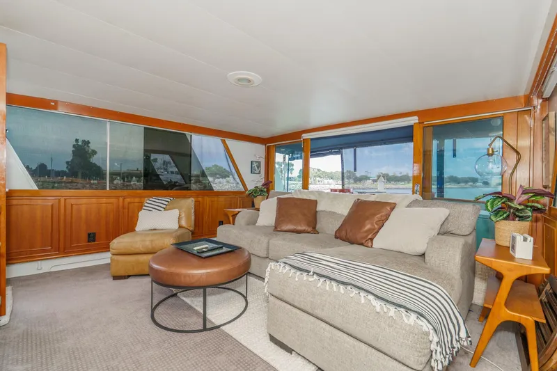 Slide: The Image of Luxurious 1969 Burger Flush Deck yacht interior with cozy seating and panoramic windows. - 30