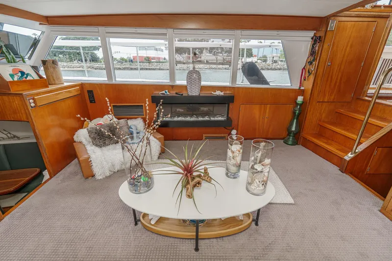 Slide: The Image of Luxurious 1969 Burger Flush Deck yacht interior with elegant decor and large windows. - 36