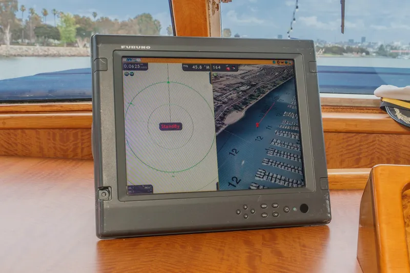 Slide: The Image of Navigation system on 1969 Burger Flush Deck yacht, displaying marina map and standby mode. - 44