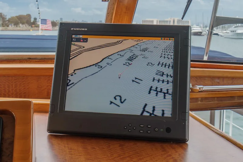 Slide: The Image of Navigation screen on 1969 Burger Flush Deck yacht, displaying nautical chart. - 45