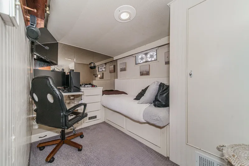 Slide: The Image of Compact bedroom with desk and chair in a 1969 Burger Flush Deck yacht. - 55