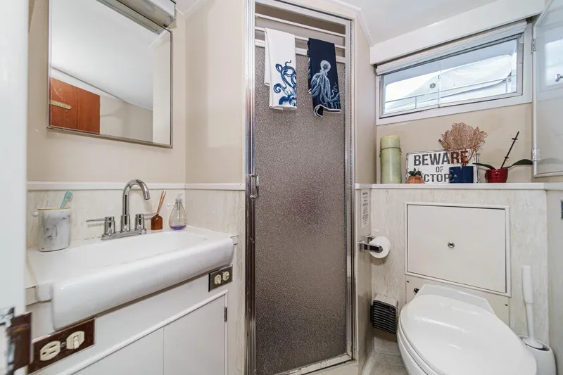Slide: The Image of Bathroom interior of a 1969 Burger Flush Deck yacht with shower and sink. - 56