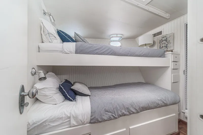 Slide: The Image of Bunk beds in a 1969 Burger Flush Deck yacht cabin with nautical decor. - 65