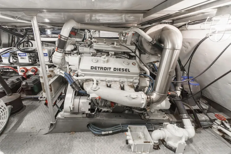 Slide: The Image of Engine room of a 1969 Burger Flush Deck yacht featuring a Detroit Diesel engine. - 74
