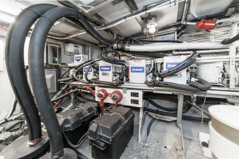 Slide: The Image of Engine room of a 1969 Burger Flush Deck yacht with mechanical equipment and wiring. - 80
