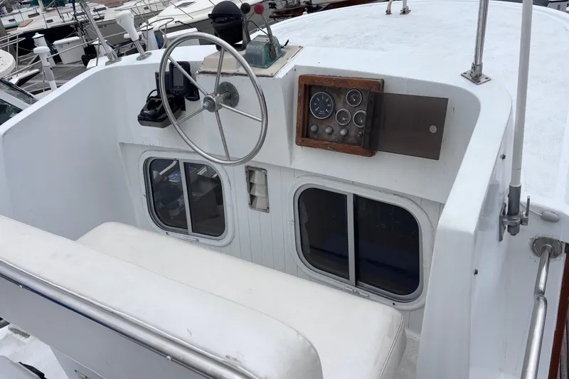 Slide: The Image of Cockpit of 1985 Transpacific Marine Pacific Eagle 32 with steering wheel and instrument panel. - 14