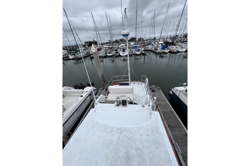 Slide: The Image of 1985 Transpacific Marine Pacific Eagle 32 docked in a marina with sailboats. - 15