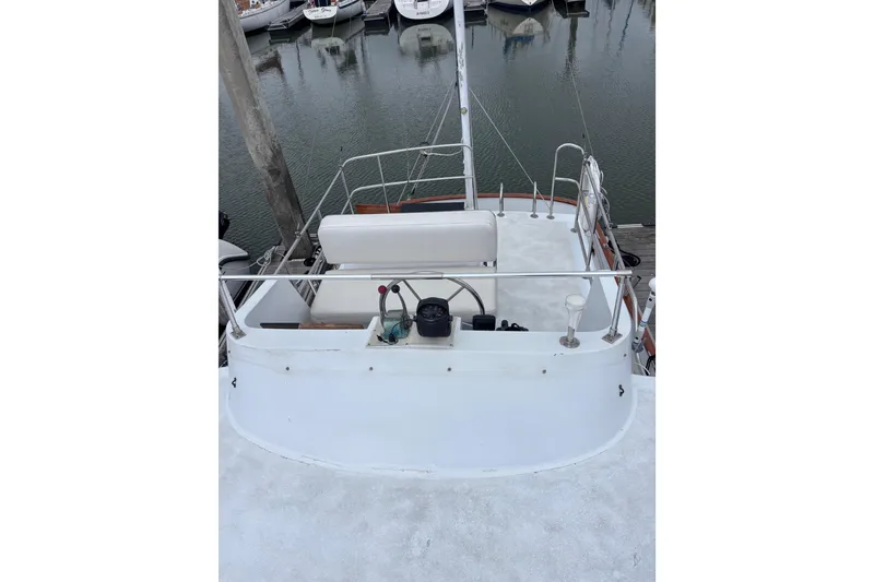 Slide: The Image of 1985 Transpacific Marine Pacific Eagle 32 boat deck with seating and steering wheel. - 16