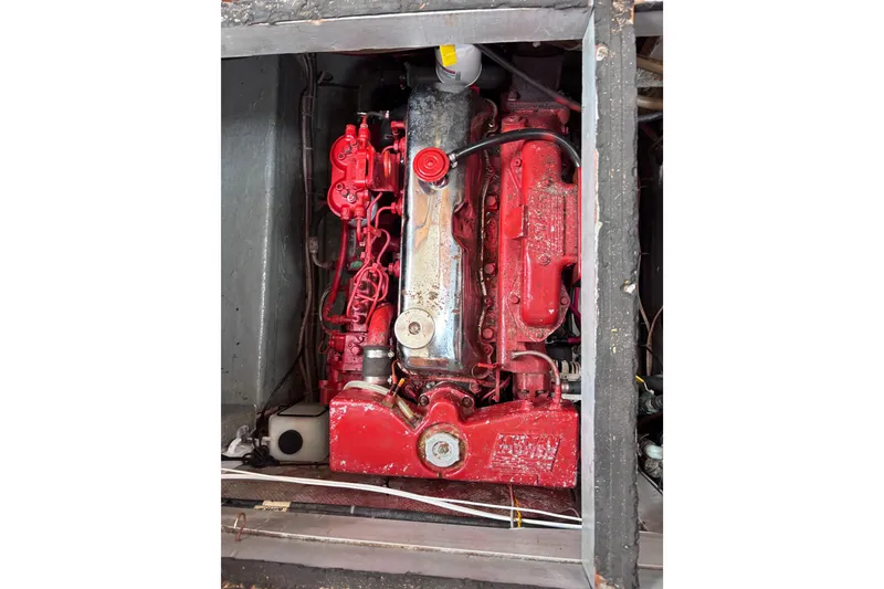 Slide: The Image of Red engine of a 1985 Transpacific Marine Pacific Eagle 32 boat, detailed view. - 32